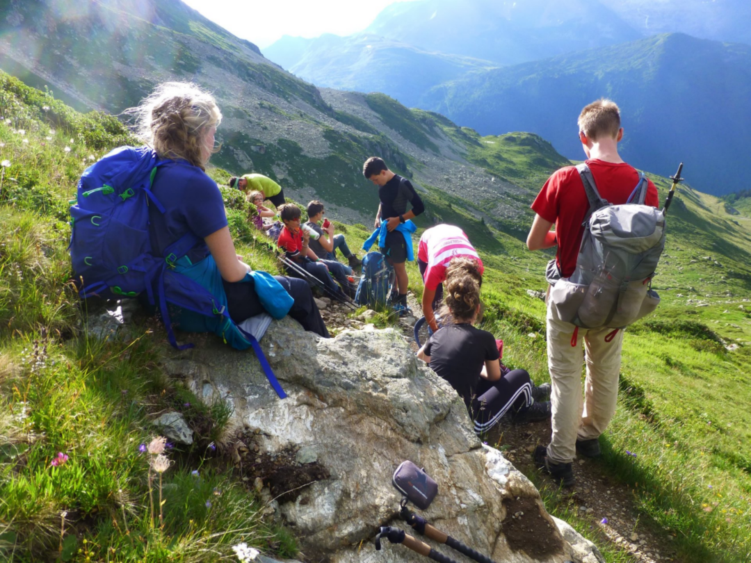 Essential Guide: What to Pack for Switzerland for a Perfect Trip 3 A variety of footwear including hiking boots, walking shoes, and ski boots