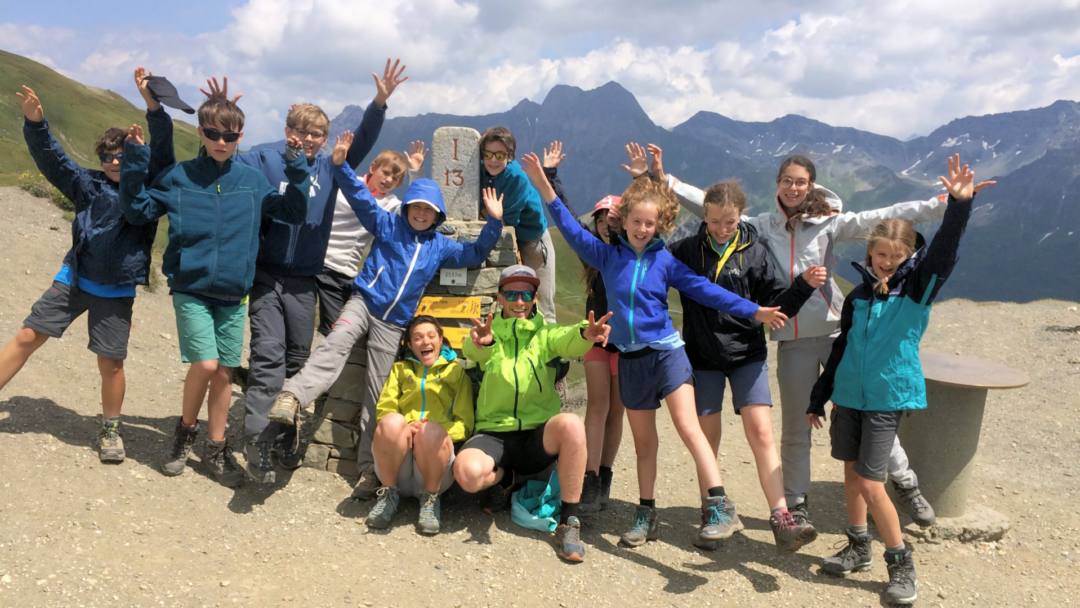 Discover the Adventure: Your Ultimate Guide to Camp Montana in Switzerland 5 Campers from different nationalities celebrating International Friendship Day at Camp Montana