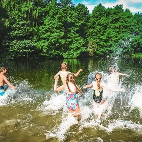 Group of students engaged in fun activities at a water sports Young Explorers camp