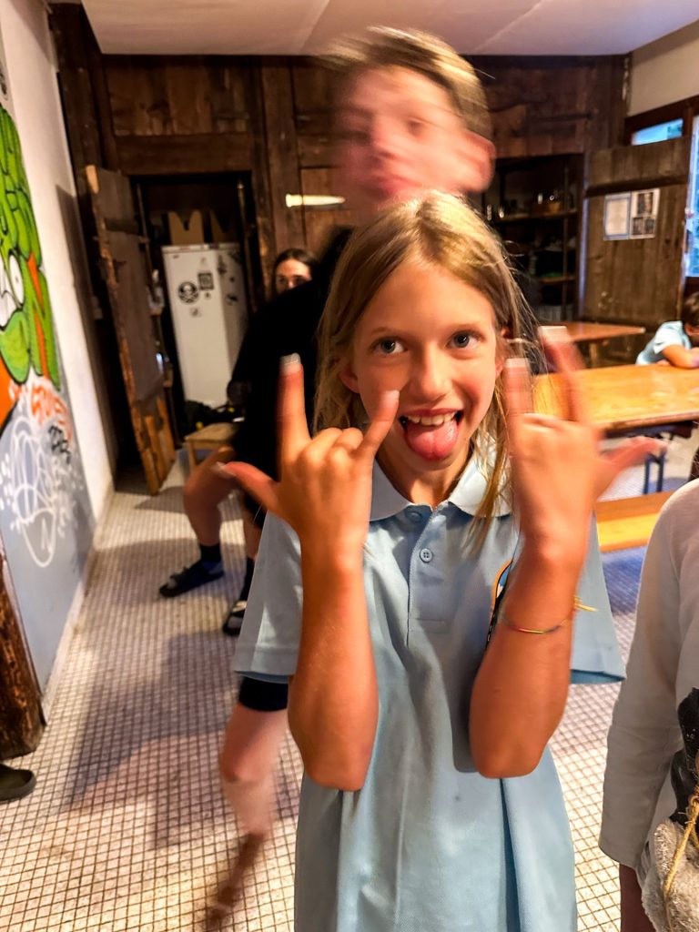 Girl pulling a funny face in the chalet dining room